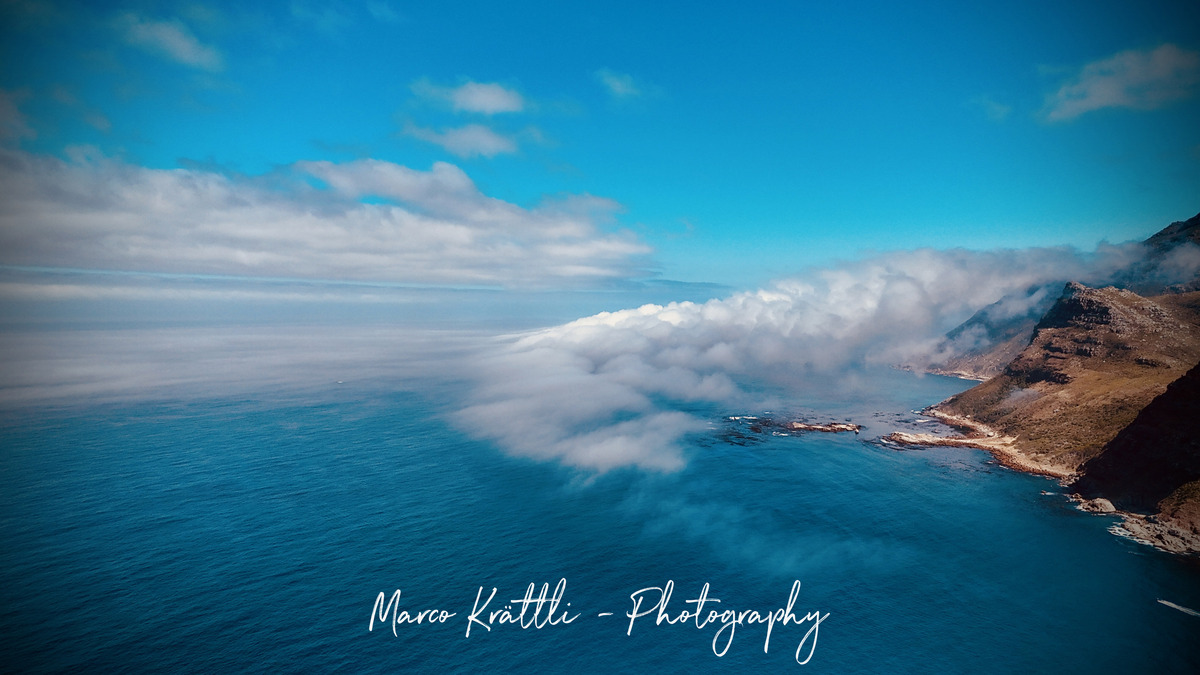 Clouds spilling over the cliffs of Chapman's Peak Drive